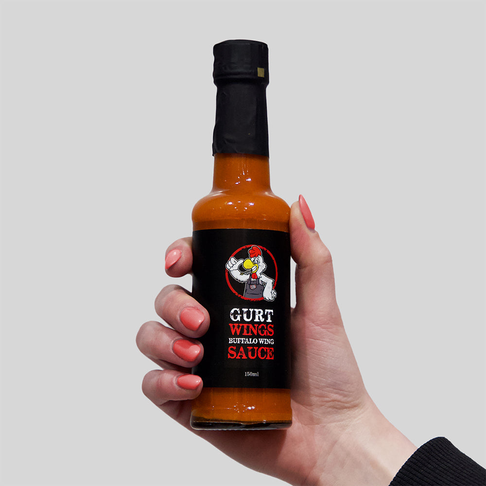 gurt wings buffalo sauce bottle held